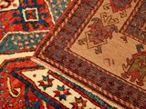 an image of a close up of a rug with a cat sitting on top of it
