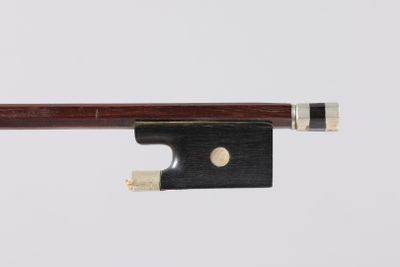a close up of a violin bow on a white background