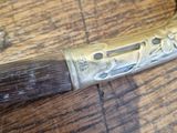 a knife that is laying on top of a wooden table
