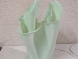 a glass vase that is sitting on a table