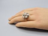 an image of a woman ' s hand with a diamond ring on it
