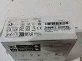 a white box with a sticker on it sitting on a table