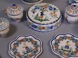 many plates and bowls on a table with blue and white designs