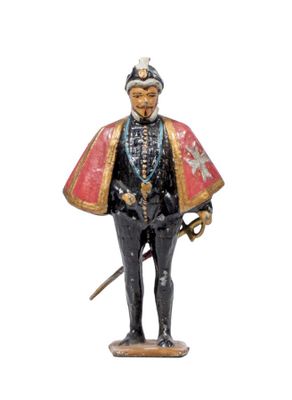 figurine of a man dressed in a military uniform and holding a sword