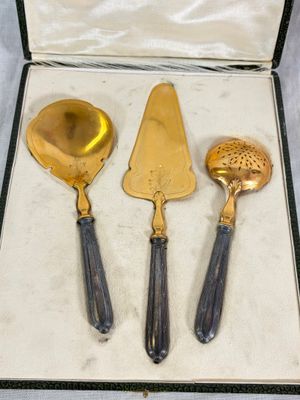 three different types of silverware in a box