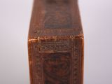 a small wooden box with a picture of a man on it