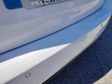 a close up of a car ' s bumper with a sticker on it