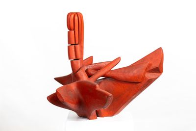 a red sculpture that is sitting on top of a table