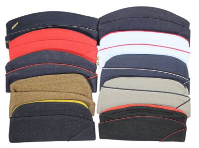 several different colors of hats stacked on top of each other