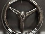 an image of a close up of a steering wheel on a table