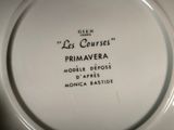 a white plate with writing on it that says les courses primaveraa