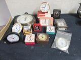 many different types of clocks on the table