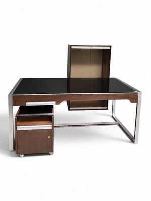 an image of a desk with a computer on top of it