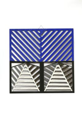 two blue and silver triangles are hanging on a white wall