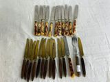 a lot of knives and knives that are on a table