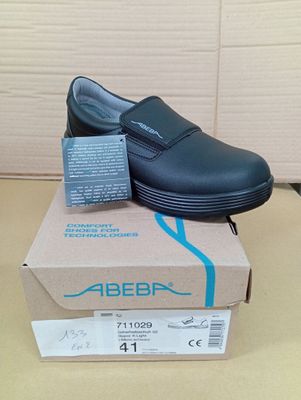a box with a pair of shoes on top of it