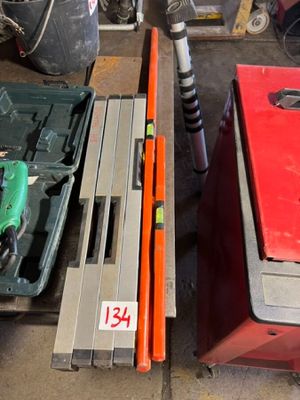 many tools that are sitting on the floor in the garage