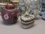 many different vases and containers sitting on a table