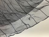 a black and white photo of a piece of fabric