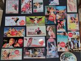 a black table topped with pictures of women and coca colas