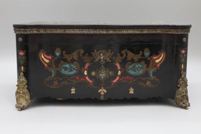 a black chest with a floral design on it