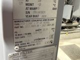a sign on the side of a machine in a factory