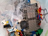 a pile of legos in a plastic bag on a table