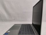 an open laptop computer sitting on top of a white surface