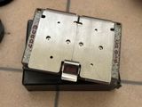 a metal device that is sitting on top of a box