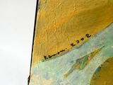 un gros plan d'un tableau représentant une personne sur une planche de surf