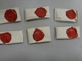 four pieces of wax on top of each other on a table