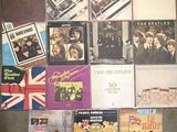 a lot of beatles albums on the floor
