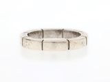 a close up of a silver ring on a white surface