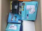 a cardboard box filled with electronic devices and other items