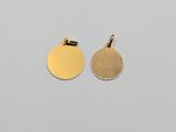 a pair of gold disc charms on a white background