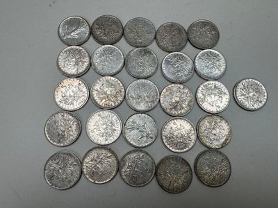 some silver coins are arranged in a square on a table