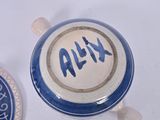 a blue and white cup and saucer sitting on a table