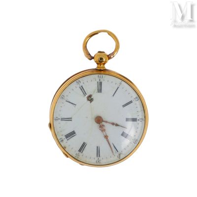 une montre de poche en or avec des chiffres romains sur le cadran