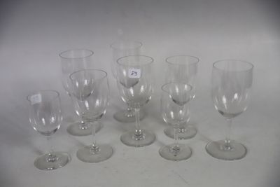 several empty wine glasses sitting on top of a white table