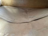 a close up of a piece of leather on a chair