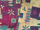 a close up of a colorful patchwork quilt on a table