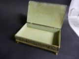 a small box with a lid on a table