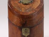 an old wooden box sitting on top of a white surface