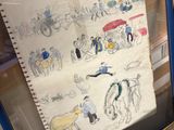 a picture of a drawing on a piece of paper in a glass case