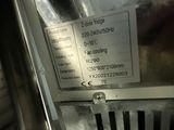 a picture of a donut machine with a price label on it