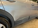 a close up of a car that has a denting on it