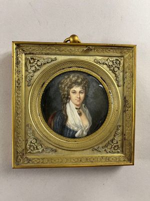 portrait of a woman in a blue dress in a gold frame