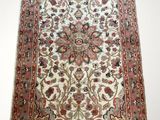 an antique persian rug with a floral design on a white background