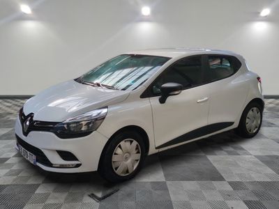 the white car is parked on a checkered floor in the garage