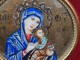 a picture of a picture of a woman holding a baby
